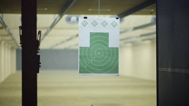 Target practice session at indoor shooting range in calm environment