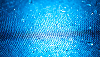 A close-up of a textured metallic surface with a subtle blue hue.