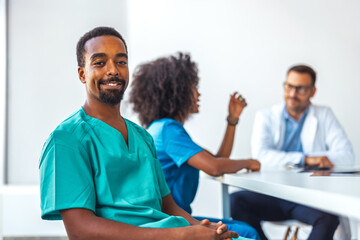 Smiling Healthcare Workers in a Professional Meeting Setting in Modern Office