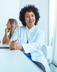 Professional Doctor in Lab Coat Engaging in a Consultation at a Work Environment
