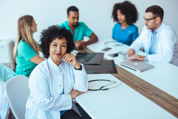 Healthcare Professionals Collaborating During a Strategy Meeting in a Modern Office