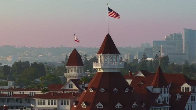 Discover breathtaking aerial views showcasing the historic Hotel Del Coronado located in beautiful San Diego, highlighting its renowned and iconic architecture set against the vibrant urban skyline
