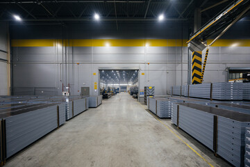 Packages of construction formwork. Construction materials stacked in factory warehouse