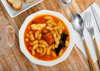 Tasty stew of asturian beans in gravy with various sausages