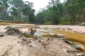 Photograph of the Capertee River at very low levels running through the Capertee Valley after major flood damage in the Wollemi National Park in NSW, Australia.