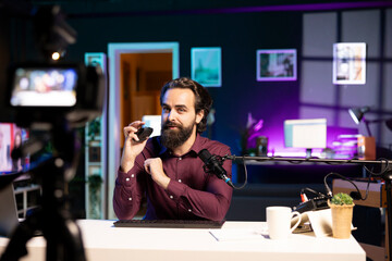 Influencer promoting wireless office mouse from sponsor to audience. Content creator paid by brand...