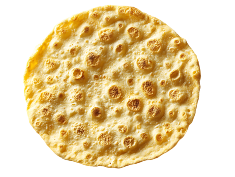 Crispy yellow papadum round isolated on transparent background