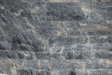Texture mineral of stone quarry after gold and copper ore mining, showing different layers...