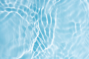 Blue water with ripples on the surface. Defocus blurred transparent blue colored clear calm water...