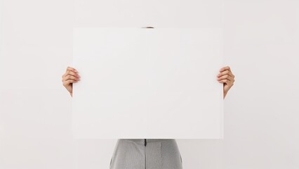 Fototapeta premium Hands holding blank white poster board