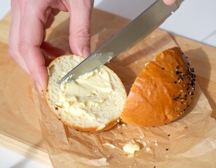 Woman cutting bread. 