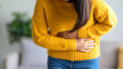 Experiencing Abdominal Discomfort Young Woman Grasps Stomach in Distress