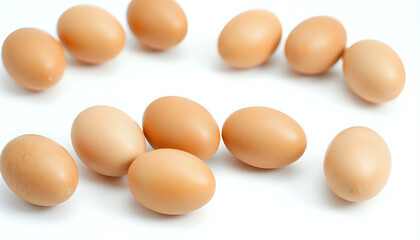 Fresh brown eggs with natural texture, isolated on a pure white background under soft overhead lighting.