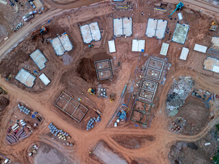 Excavators working on construction site of new residential area, aerial view