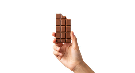 Hand holding a bitten milk chocolate bar against a black background in a studio shot