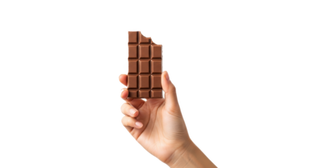 Hand holding a bitten milk chocolate bar against a black background in a studio shot