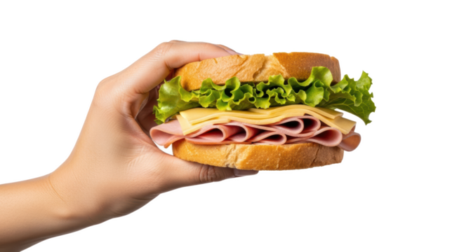 Hand holding a sandwich with ham cheese and lettuce against a black background close up view