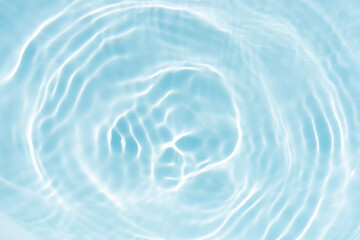 Blue water with ripples on the surface. Defocus blurred transparent blue colored clear calm water...