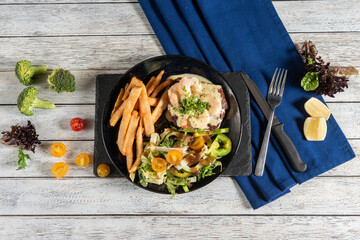 Delightful Gourmet Burger Served With Crispy Fries