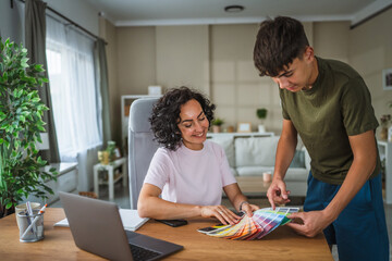teenage boy and mother show color palette on video call with client