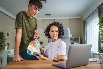 teenage boy and mother show color palette on video call with client
