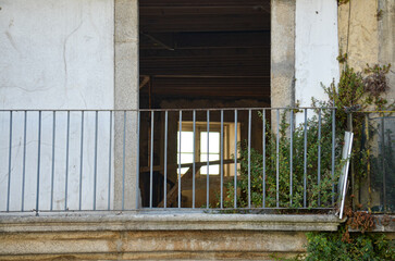 Abandoned Balcony with Iron Railing in Porto