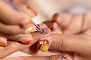 Nail art treatment at home nail salon creates beauty and fashion with detailed designs and decorations enhancing personal style and self care enjoyment