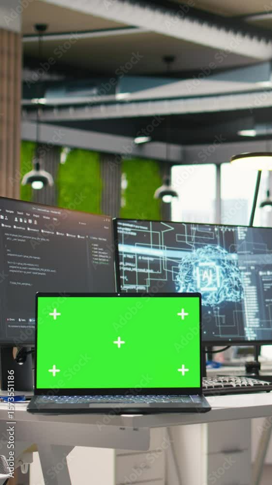 Fototapete vertical video green screen laptop and ai algorithms running on computer monitors in empty startup w