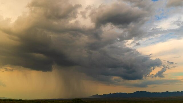 Time-lapse of a monsoon storm cloud in the Arizona desert at sunset. 