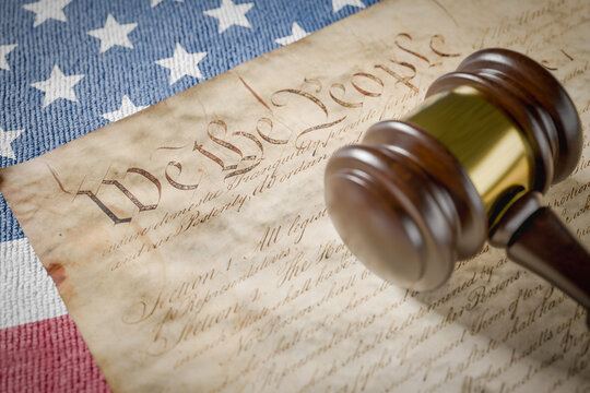 United States Constitution, Gavel and American Flag Resting on Table. - Powered by Adobe