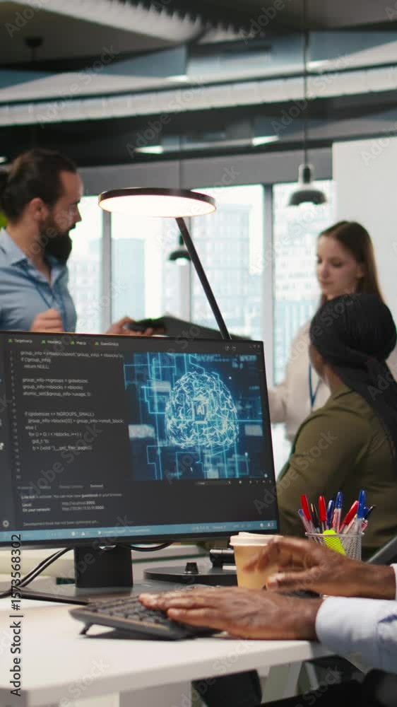 Poster vertical video system administrator in office using pc, automating repetitive tasks with ai scripts.