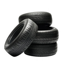 A stack of four black car tires with detailed tread patterns against a dark background in a studio shot on transparent background