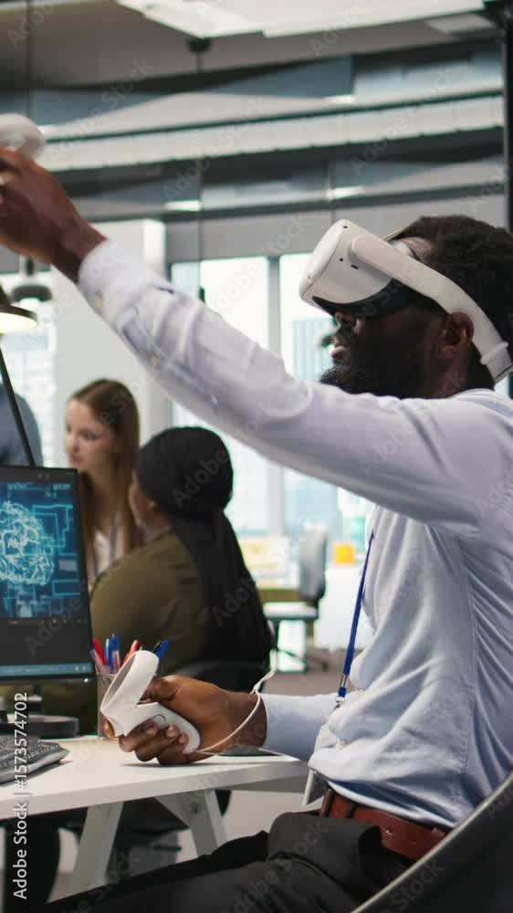 Fototapete vertical video programmer wearing vr headset at office desk developing programs using ai automation.