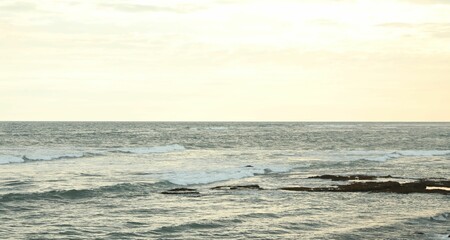 View of wavy sea under beautiful sky