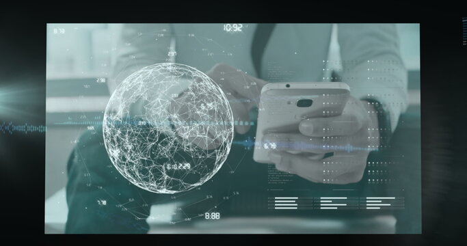 Analyzing casually dressed adult holding phone, viewing globe in office with data waveform overlays