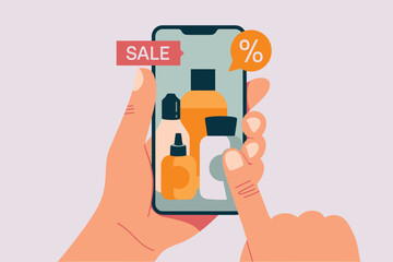 Hands holding a smartphone displaying cosmetic bottles with a sale and discount notification