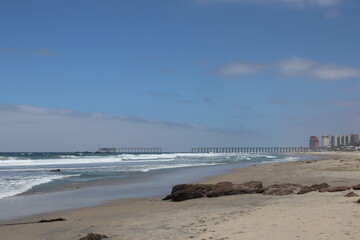Fototapeta premium Broken beach boardwalk at playa de rosarito in Rosarito Mexico