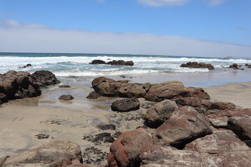 Tide pool clearing with rocks and sand in playa de rosarito Rosarito Mexico