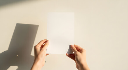Obraz premium Blank Paper Mockup Hands Holding Clean White Sheet