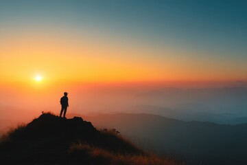 Solitary Adventurer Gazing at Vibrant Sunset Over Mountainscape