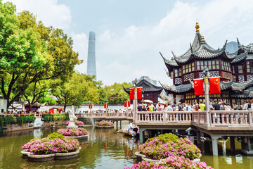 Shanghai. Visitors enjoy Yuyuan Garden in Shanghai on a sunny afternoon amid traditional...