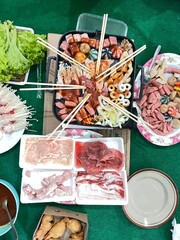 Culinary Feast: An overhead view of a vibrant and diverse array of fresh ingredients prepared for an enticing culinary experience. a symphony of tastes and textures is artfully arranged.