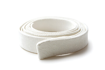 Crisp white canvas belt coiled against a pristine backdrop, perfect for adding a minimalist touch to fashion designs, or crafting projects.