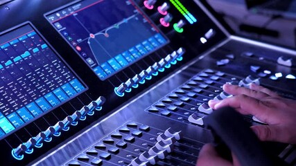 Music composer hand on buttons of sound mixer in studio