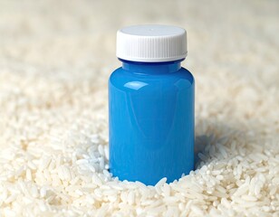 Blue pill bottle in white rice