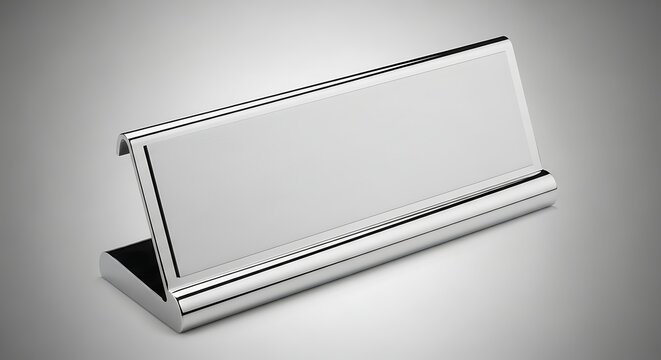 Elegant name plate with polished metal frame on neutral gray backdrop for corporate branding