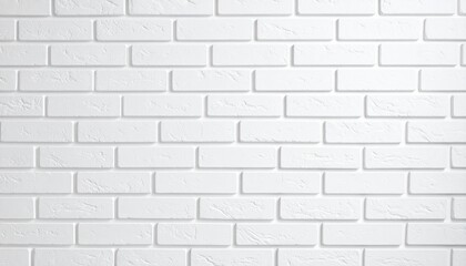 Fototapeta premium A close-up image of a freshly constructed wall made of clean, white bricks arranged in neat rows.