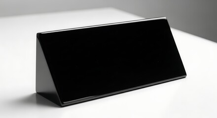 Sleek black nameplate against a minimalist white backdrop for corporate branding