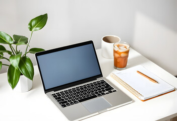 Laptop with a cup of coffee on the table in the office

