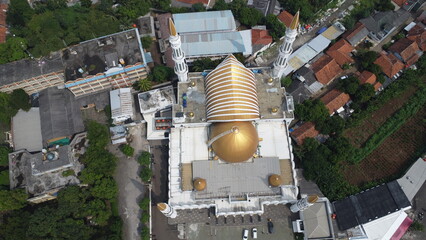 Aerial panoramic view of stunning beautiful mosque's architecture, showcasing a beautiful cityscape...